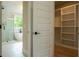 Modern bathroom includes walk-in glass shower, soaking tub, and a view from the window at 1709 Eastside Parc St, Atlanta, GA 30316