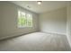 Bright bedroom with neutral carpet and a large window offering plenty of natural light at 1709 Eastside Parc St, Atlanta, GA 30316