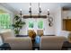 Dining room showcases an elegant light fixture above the table and sliding glass doors with views of the backyard at 1709 Eastside Parc St, Atlanta, GA 30316