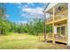 Exterior showcasing the wooden decks, patio, and green lawn surrounding the property at 1709 Eastside Parc St, Atlanta, GA 30316