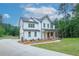 Charming two-story home with white siding, dark roof, and a well-manicured lawn at 1709 Eastside Parc St, Atlanta, GA 30316
