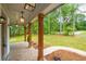 Inviting front porch with brick flooring, timber columns, and lantern lighting at 1709 Eastside Parc St, Atlanta, GA 30316