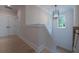 Bright hallway features modern lighting fixture and wood flooring at 1709 Eastside Parc St, Atlanta, GA 30316