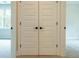 Hallway featuring large closet doors, carpeted flooring, and neutral-colored walls at 1709 Eastside Parc St, Atlanta, GA 30316