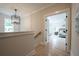 Hallway view leading into main bedroom with lots of natural light and hardwood floors at 1709 Eastside Parc St, Atlanta, GA 30316