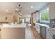 Modern kitchen with island, pendant lighting, stainless appliances, and hardwood floors at 1709 Eastside Parc St, Atlanta, GA 30316