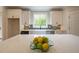 Bright kitchen with white cabinets, quartz countertops, and stainless steel appliances at 1709 Eastside Parc St, Atlanta, GA 30316