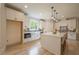 Bright kitchen with white cabinets, quartz countertops, and a large kitchen island at 1709 Eastside Parc St, Atlanta, GA 30316