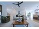 Cozy living room with a comfortable sofa, arm chair, and a ceiling fan at 1709 Eastside Parc St, Atlanta, GA 30316