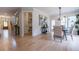 Open-concept living area with hardwood floors, stylish decor, and access to dining area at 1709 Eastside Parc St, Atlanta, GA 30316