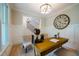 Charming home office with natural light features a large decorative clock at 1709 Eastside Parc St, Atlanta, GA 30316