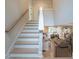 Stairway with open floorplan boasts natural light and wood floors at 1709 Eastside Parc St, Atlanta, GA 30316