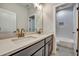 Bathroom featuring double sinks with modern fixtures, vanity, and shower at 1697 Eastside Parc St, Atlanta, GA 30316