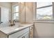 Bathroom featuring double sinks with modern fixtures, vanity, and a well-lit mirror at 1697 Eastside Parc St, Atlanta, GA 30316