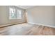 Bright bedroom with hardwood floors, white trim, and a large window at 1697 Eastside Parc St, Atlanta, GA 30316