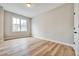 Bright bedroom with hardwood floors, a window with views, and white trim at 1697 Eastside Parc St, Atlanta, GA 30316