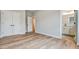 A room with hardwood floors, closet, with a view of the bathroom at 1697 Eastside Parc St, Atlanta, GA 30316