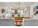 Dining area featuring modern chandelier and open view to kitchen space at 1697 Eastside Parc St, Atlanta, GA 30316