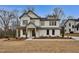 Charming two-story home with white siding, well-maintained landscaping, and a welcoming front porch at 1697 Eastside Parc St, Atlanta, GA 30316