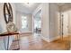 Elegant foyer with hardwood floors, console table, mirror, and views into other rooms at 1697 Eastside Parc St, Atlanta, GA 30316