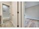 A view of a bathroom with white subway tile with doorway and a bedroom with hardwood floors at 1697 Eastside Parc St, Atlanta, GA 30316