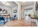 Hallway featuring hardwood floors and access to a bright office space with modern decor at 1697 Eastside Parc St, Atlanta, GA 30316