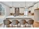 Modern kitchen with stainless steel appliances, a large island, and stylish pendant lighting at 1697 Eastside Parc St, Atlanta, GA 30316