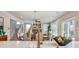 Open-concept living area featuring a modern kitchen with views of the dining and living space at 1697 Eastside Parc St, Atlanta, GA 30316