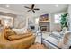 Living room with stylish furniture, fireplace, and stairs to upper floor at 1697 Eastside Parc St, Atlanta, GA 30316