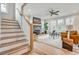 Open living room with fireplace, bright windows and modern design at 1697 Eastside Parc St, Atlanta, GA 30316