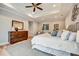 Inviting main bedroom with neutral decor, tray ceiling, and ample natural light, creating a serene retreat at 1697 Eastside Parc St, Atlanta, GA 30316