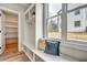 Mudroom featuring custom built-ins, storage cubbies, and natural light from a large window at 1697 Eastside Parc St, Atlanta, GA 30316