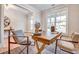 Bright office space featuring a rustic wooden desk and large window at 1697 Eastside Parc St, Atlanta, GA 30316