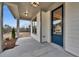 Inviting covered front porch with a blue front door and view of the front yard at 1697 Eastside Parc St, Atlanta, GA 30316