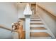 Elegant staircase featuring wood treads, white risers, and a modern railing, connecting the home's levels at 1697 Eastside Parc St, Atlanta, GA 30316