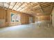 Unfinished basement with exposed framing, ready for customization with ample natural light at 1702 Eastside Parc St, Atlanta, GA 30316