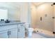 Modern bathroom featuring granite counters, undermount sink, and glass enclosed shower at 1702 Eastside Parc St, Atlanta, GA 30316