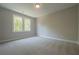 Cozy bedroom with large windows and plush carpeting at 1702 Eastside Parc St, Atlanta, GA 30316