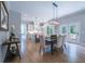 Elegant dining area with modern lighting, kitchen views, and access to an outdoor seating area at 1702 Eastside Parc St, Atlanta, GA 30316