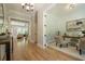 Inviting entryway featuring hardwood floors leading to the living spaces and a cozy home office with french doors at 1702 Eastside Parc St, Atlanta, GA 30316