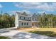 Charming two-story home with a manicured lawn and a long concrete driveway at 1702 Eastside Parc St, Atlanta, GA 30316