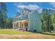 Beautiful craftsman home boasts a covered front porch and lush greenery at 1702 Eastside Parc St, Atlanta, GA 30316