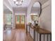 Elegant foyer with hardwood floors, a console table, and decorative mirror at 1702 Eastside Parc St, Atlanta, GA 30316