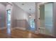 Well-lit hallway with hardwood flooring, leading to various rooms in the house at 1702 Eastside Parc St, Atlanta, GA 30316