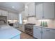 Well-appointed kitchen with stainless steel appliances, white subway tile, and custom cabinets at 1702 Eastside Parc St, Atlanta, GA 30316