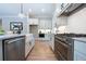 Modern kitchen with stainless steel appliances, granite counters, white cabinets, and open layout at 1702 Eastside Parc St, Atlanta, GA 30316