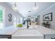 Bright, open kitchen featuring stainless steel appliances, a farmhouse sink and a view into the living area at 1702 Eastside Parc St, Atlanta, GA 30316