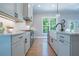 Open kitchen featuring stainless steel appliances, custom cabinets, and a white subway tile backsplash at 1702 Eastside Parc St, Atlanta, GA 30316