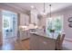 Modern kitchen featuring stainless steel appliances, granite countertops, a center island, and an adjacent breakfast nook at 1702 Eastside Parc St, Atlanta, GA 30316