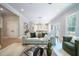 Bright open-concept living room with view of the kitchen and dining area, perfect for entertaining at 1702 Eastside Parc St, Atlanta, GA 30316